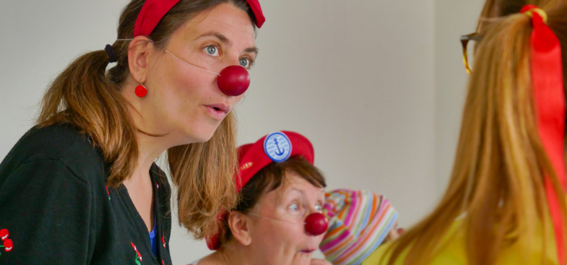 Woman dressed as a clown at an improv show