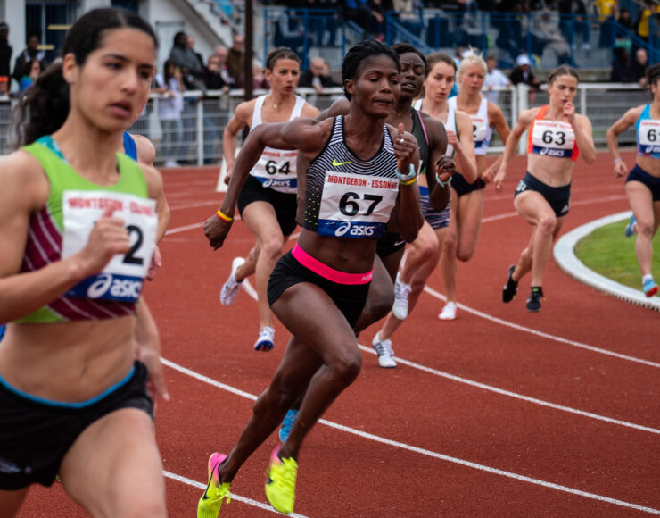 Woman in the middle of a running competition