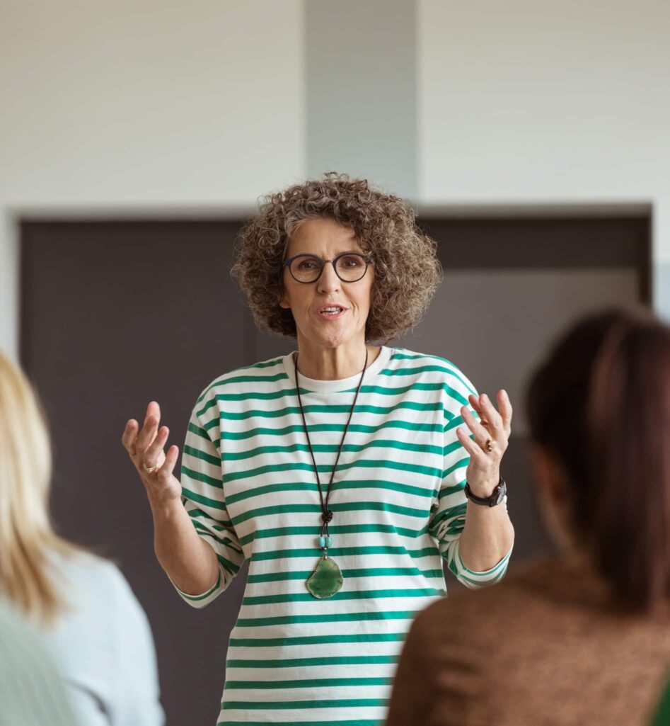 A woman explaining something to an audience