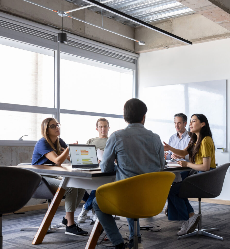 Group of five in a meeting room