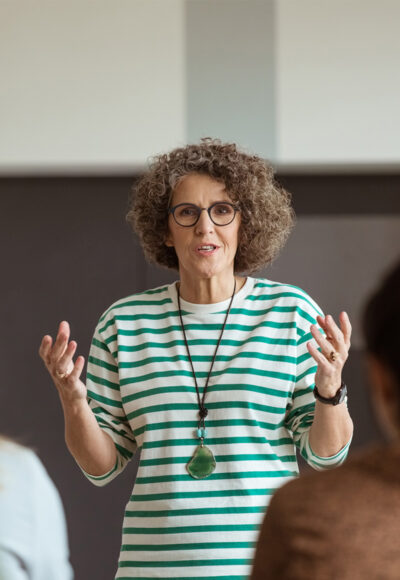 A woman explaining something to an audience