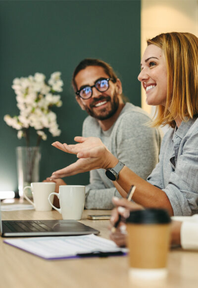 A woman talking to her team during a meeting.