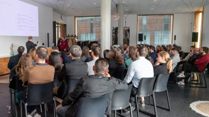 Team in a room, in front of a presentation, during a seminar