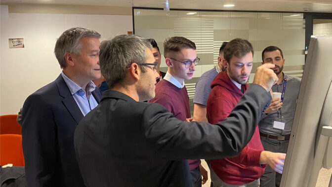 Group working on a digital screen